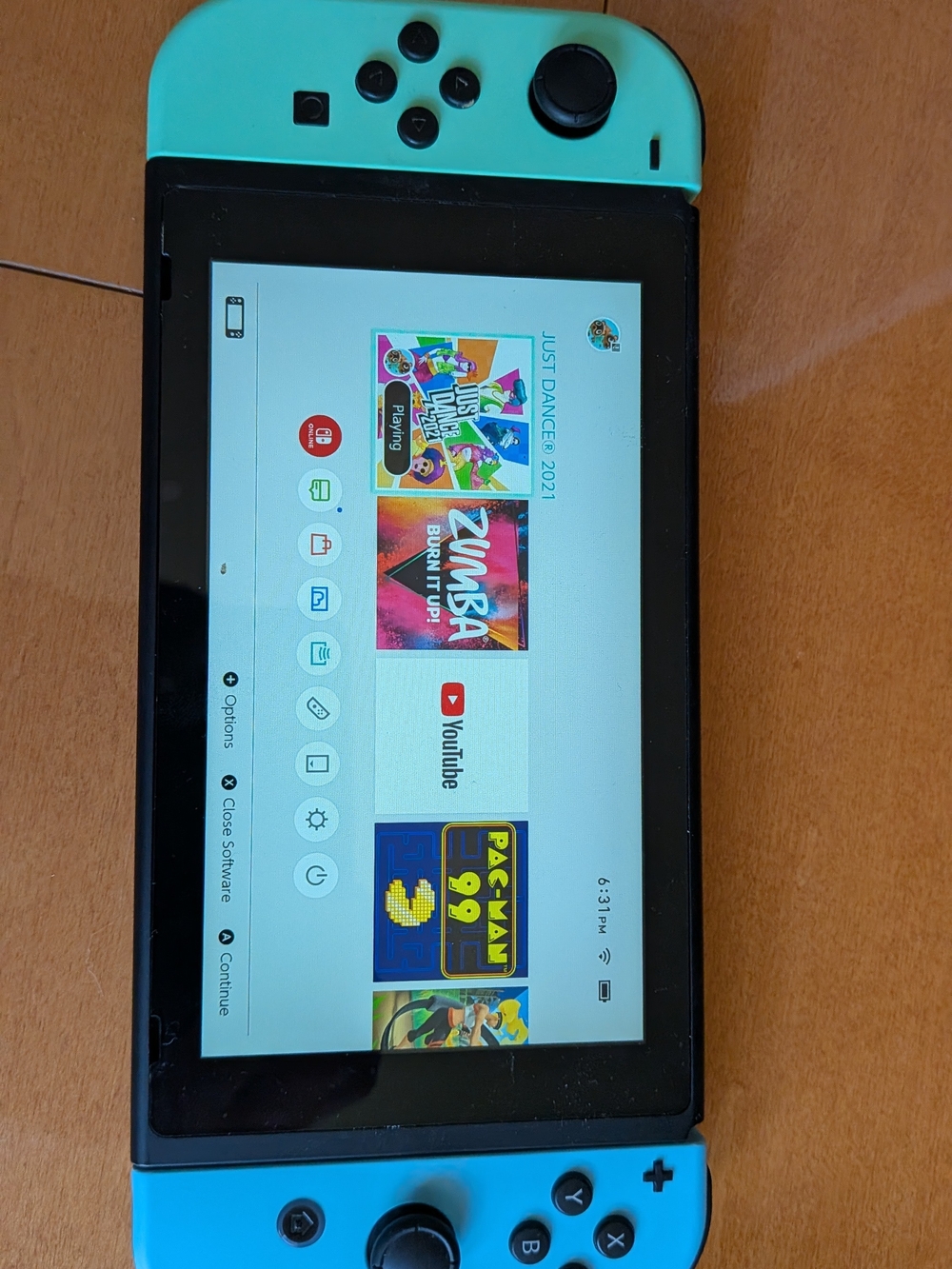 Nintendo Switch with Bright Turquoise and Cyan Joy-Con. Two Games Included